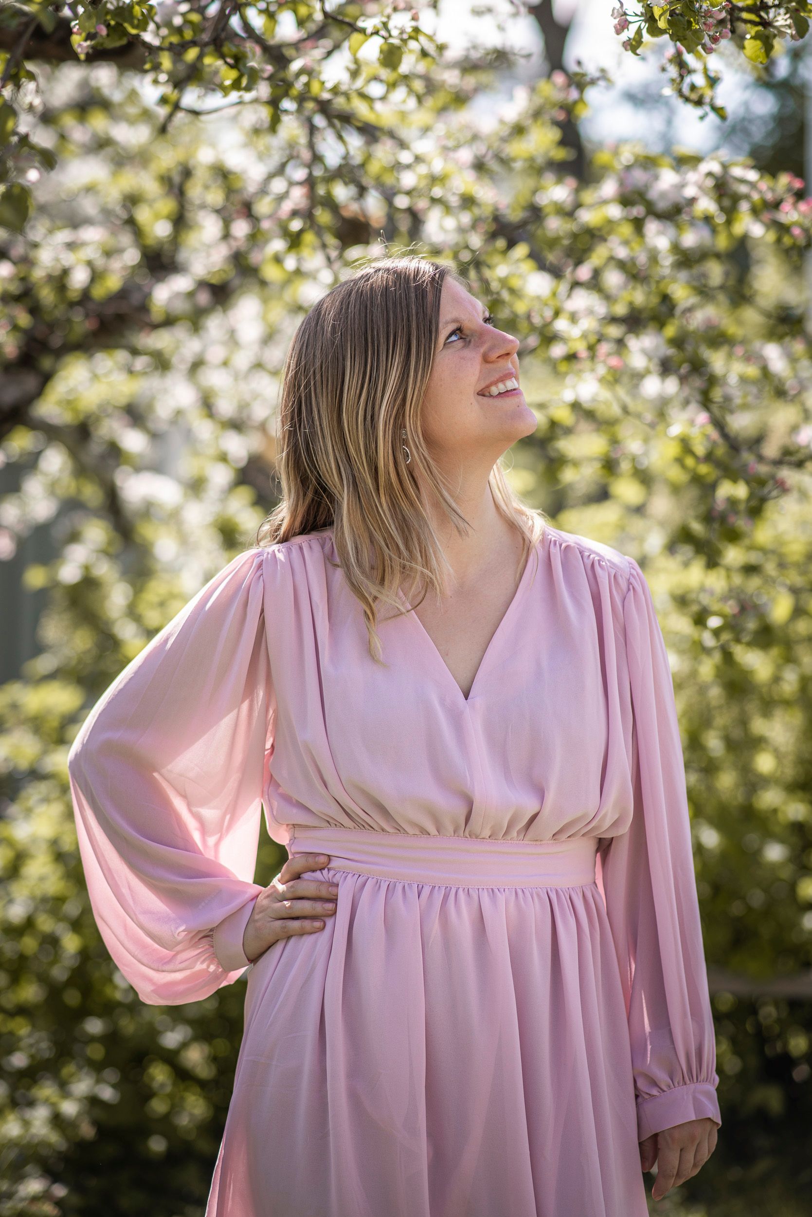 A picture of amanda when she is looking up to the trees